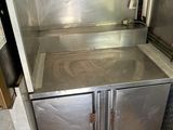 a stainless steel cabinet with a sink in it
