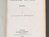 an open book with a black and white image of the title of victor hugo
