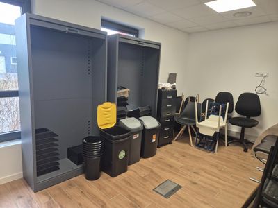 a photo of a room with a bunch of trash cans