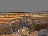 a close up of a wooden table with a mirror on it