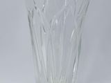 a clear glass vase sitting on a white surface
