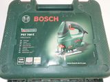 the box of a bosch jig saw is open on the table