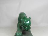 green marble sculpture of a cat on a black base