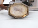 an image of a close up of a watch on a table