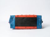 blue, orange and black leather bag on a white background
