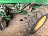 a tractor that is sitting in the dirt