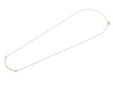 a close up of a necklace on a white background