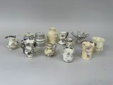 a lot of vases that are sitting on a table