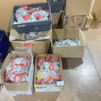 several boxes of assorted candy sitting on the floor in a room