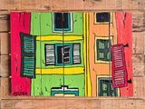 a picture of a picture of a colorful building on a pallet