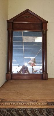 a mirror that is sitting on top of a table