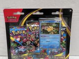 a close up of a box of pokemon cards on a white surface
