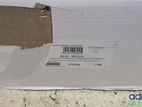a box with a barcode on it sitting on the ground