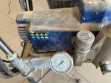 a close up of a machine with a gauge on it