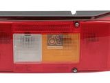 tail light assembly for the rear of a car with a red lens