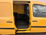 a yellow van with the door open and the driver ' s seat down