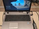 a laptop that is sitting on a table with a mouse