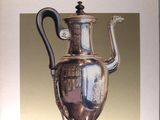 a book with a picture of a silver coffee pot on it