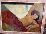 un tableau représentant une femme allongée sur un lit