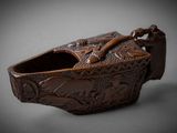 an image of a brown box with a handle on a gray surface
