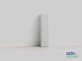 a white refrigerator sitting against a wall in the corner of a room