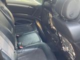 the back seats of a car are black with black trims