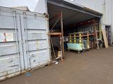 a large container sitting in the middle of a parking lot