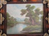 a picture of a painting of a river in a picture frame