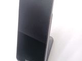 a cell phone that is sitting on top of a stand