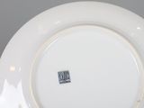 a white plate with a black and white design on it