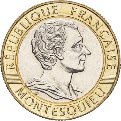un gros plan d'une pièce de monnaie à l'effigie d'une femme