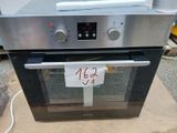 a silver oven with a price tag on the front of it