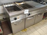 a kitchen with a lot of stainless steel appliances in it