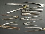 a lot of old tools that are on a table