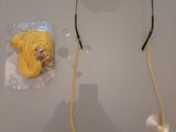 a pair of glasses and a ball of yarn next to a pair of glasses
