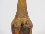 a glass bottle with a picture of a ship on it