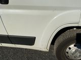 an image of a white van parked in a parking lot
