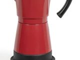 la cafetière rouge est posée sur un socle noir