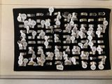 a picture of a display of silver and silver rings