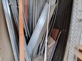 several pieces of metal are stacked up in a pile in a room
