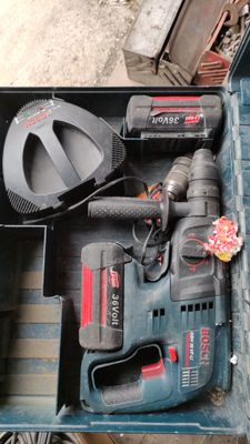 a tool box with tools inside of it on the floor
