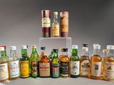 many different types of alcohol bottles on a table