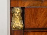 a close up of a wooden cabinet with a marble top