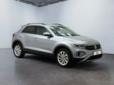 a silver volkswagen suv parked in a white room