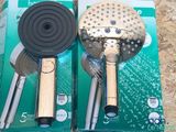 two different types of shower heads in the box