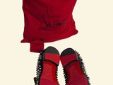 pair of red shoes and a red bag on a white background