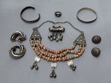an assortment of jewelry including bracelets, rings, and rings