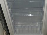 an image of a small refrigerator with its door open