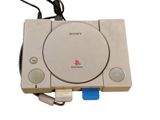 a video game console with a game controller attached to it