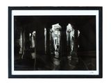 black and white photograph of a group of candles in a dark room
